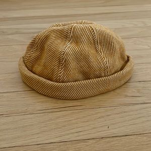 NWOT very stylish hat/ beanie with leather strap adjustment